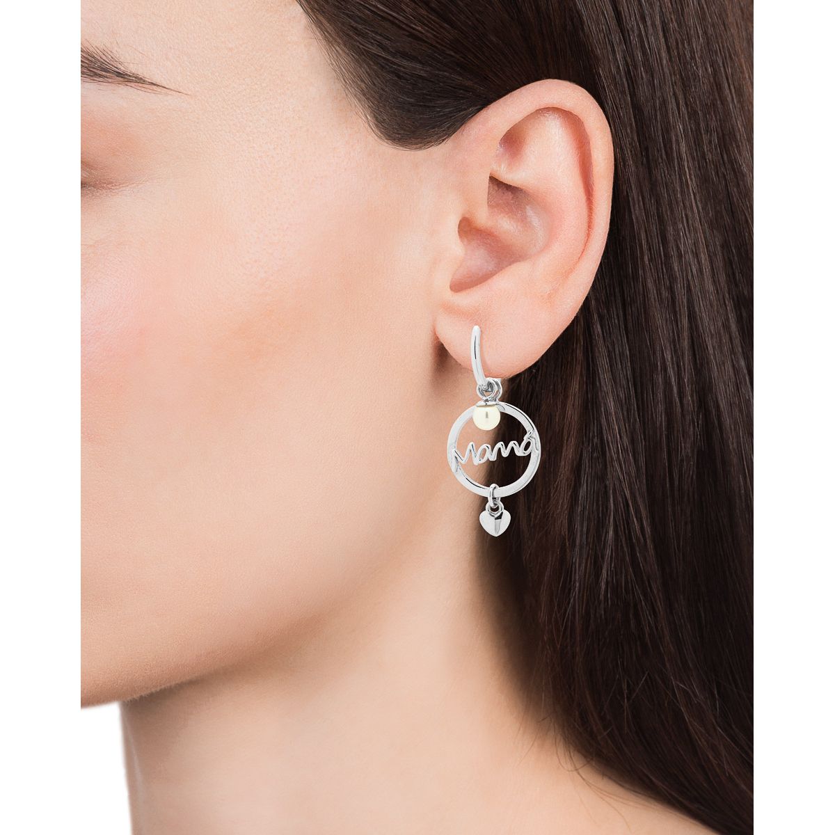 Woman wearing VICEROY JEWELS Mod. 13054E000-60 silver earrings on ear, showcasing elegant design with quartz movement and calendar function.