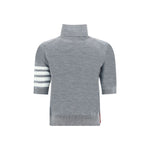 Thom Browne Turtleneck Sweater back view with iconic sleeve bands and ribbed details, showcasing its elegant monochrome design.