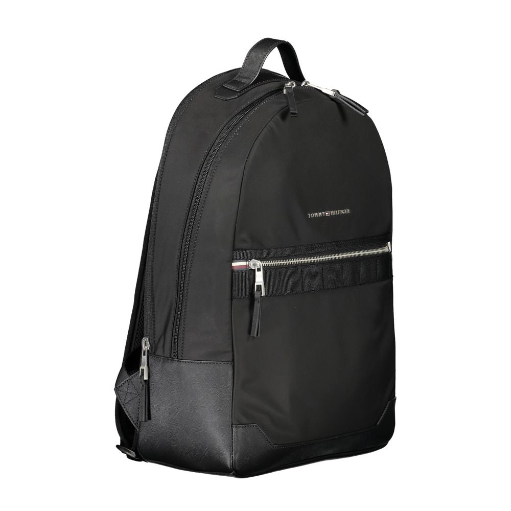 Tommy Hilfiger Black Polyester Backpack with one handle, adjustable straps, external pocket, internal compartment, and zip closure.