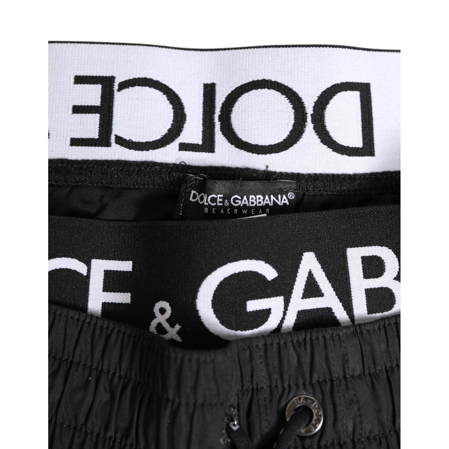 Dolce & Gabbana Black Drawstring Beachwear Men Shorts Swimwear close-up with logo detail and drawstring waistband