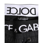 Dolce & Gabbana Black Drawstring Beachwear Men Shorts Swimwear close-up with logo detail and drawstring waistband