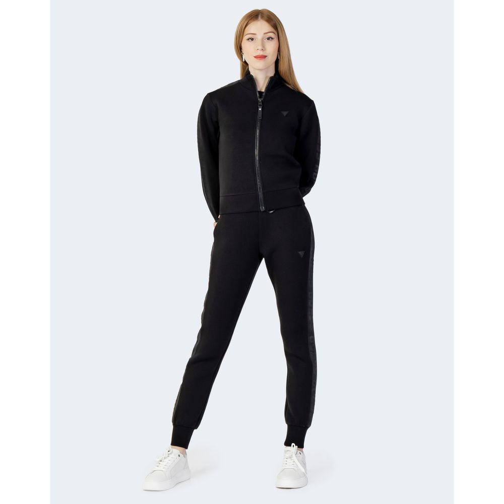 Woman wearing Guess Active Black Viscose Sweatshirt with zip, styled in sleek and sporty design, perfect for gym or casual wear.
