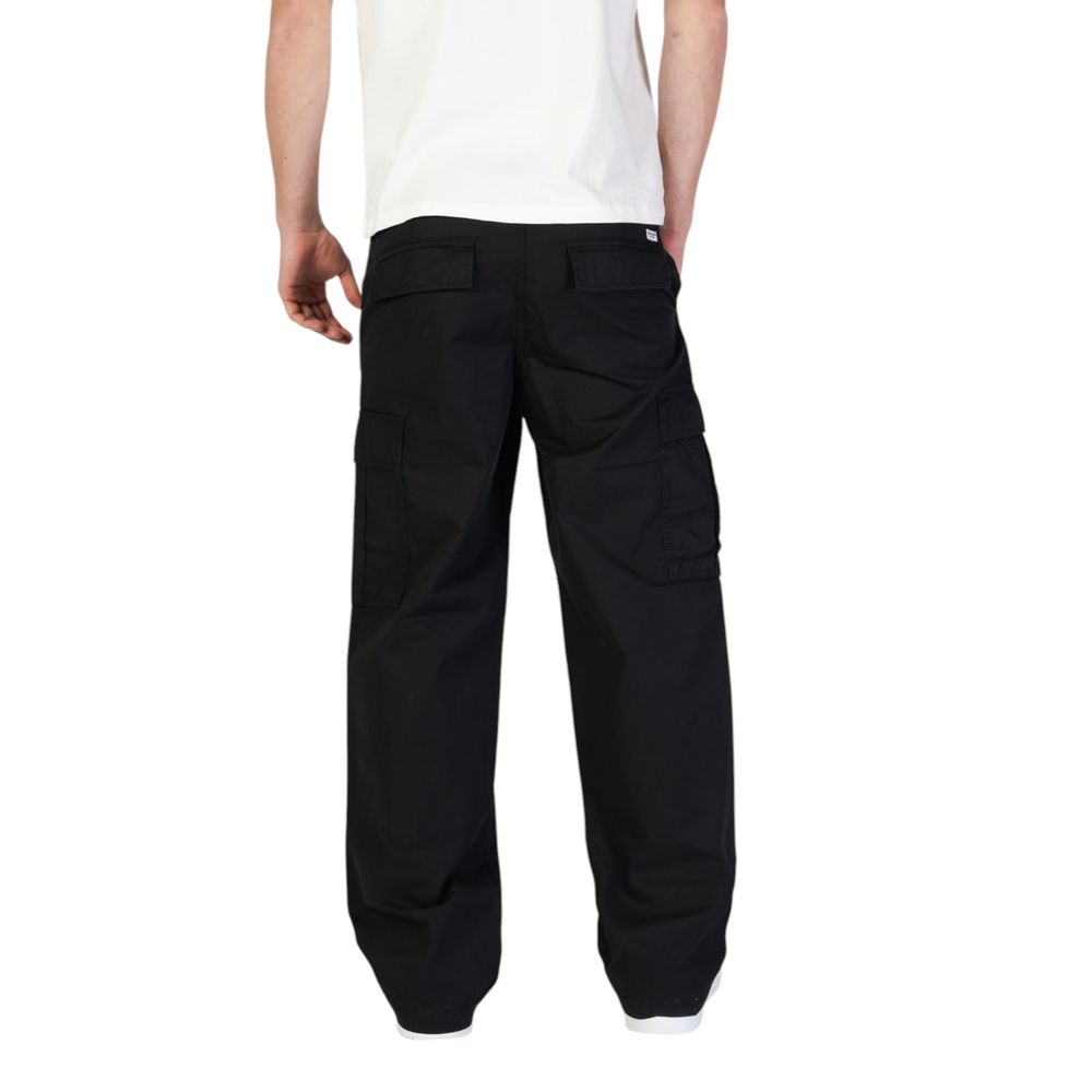 Back view of a model wearing Jack Jones Black Cotton Cargo Pants with side flap pockets, showcasing the regular fit and cotton fabric.