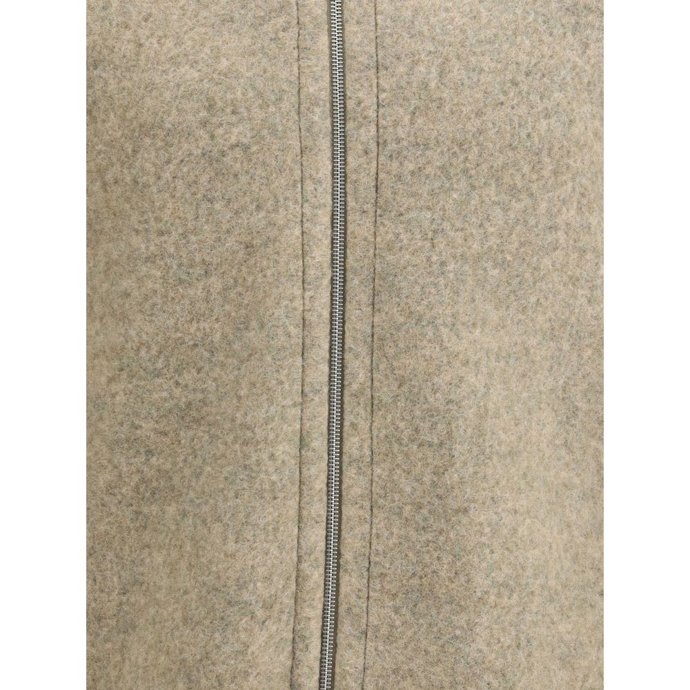 Close-up of Jil Sander Beige Wool Coat with zipper closure, showcasing its minimalist design and soft wool texture.