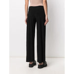 Norma Kamali Trousers Black stretch mid-rise wide leg ankle-length Jersey design shown from back view.