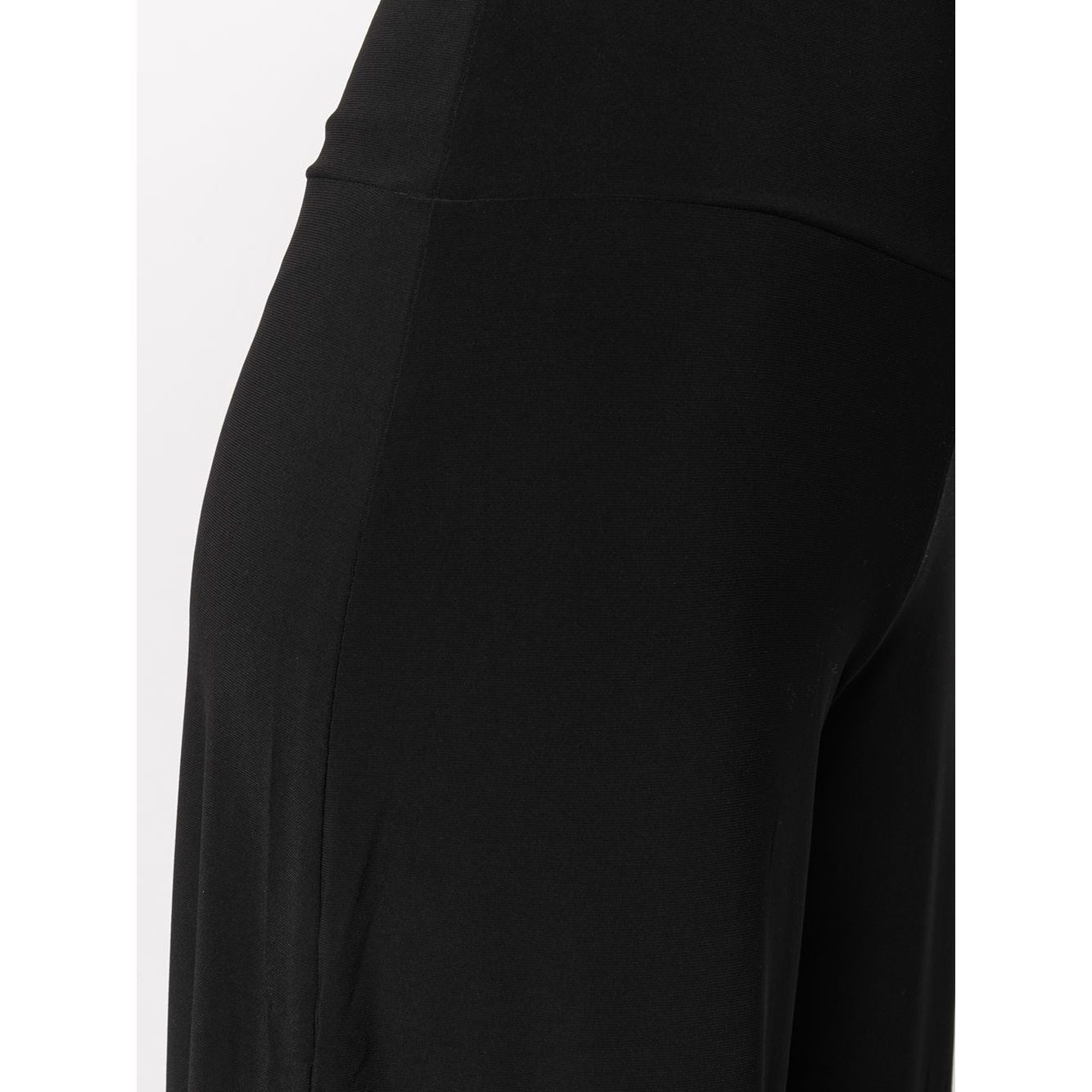 Close-up of Norma Kamali Trousers Black featuring a stretch design with mid-rise wide leg style.