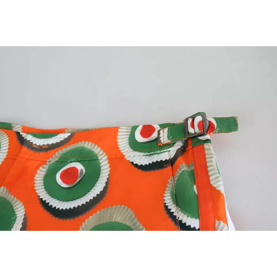 شورت سباحة على الشاطئ من دولتشي آند غابانا باللون البرتقالي على شكل كب كيك