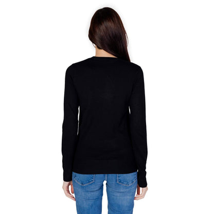 Back view of model wearing a Guess Black Cotton Sweatshirt with long sleeves and refined details.