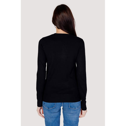 Back view of Guess Black Cotton Sweatshirt with subtle logo and decorative cuff buttons, showcasing the elegant style of the long-sleeved design.