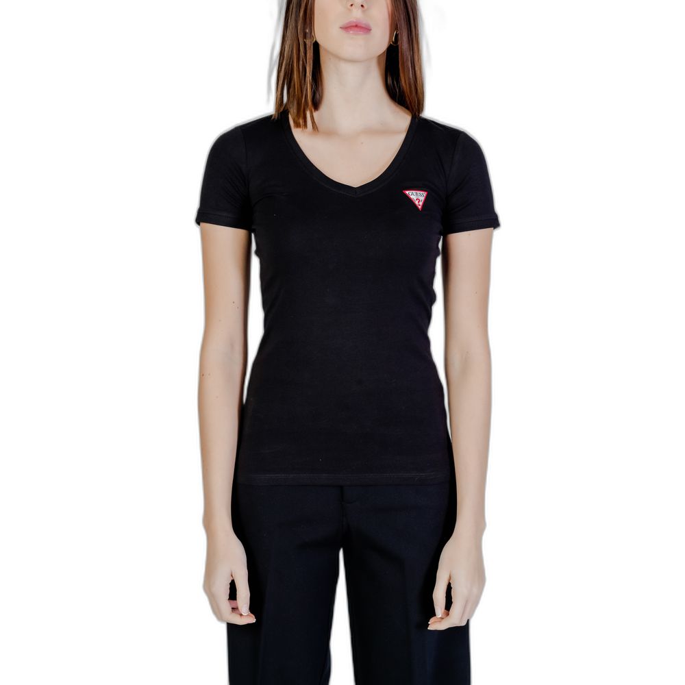 Woman wearing Guess Black Cotton T-Shirt with V-neck and mini triangle logo, short sleeves, showcases modern and feminine style.