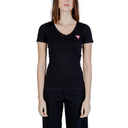 Woman wearing Guess Black Cotton T-Shirt with V-neck and mini triangle logo, short sleeves, showcases modern and feminine style.
