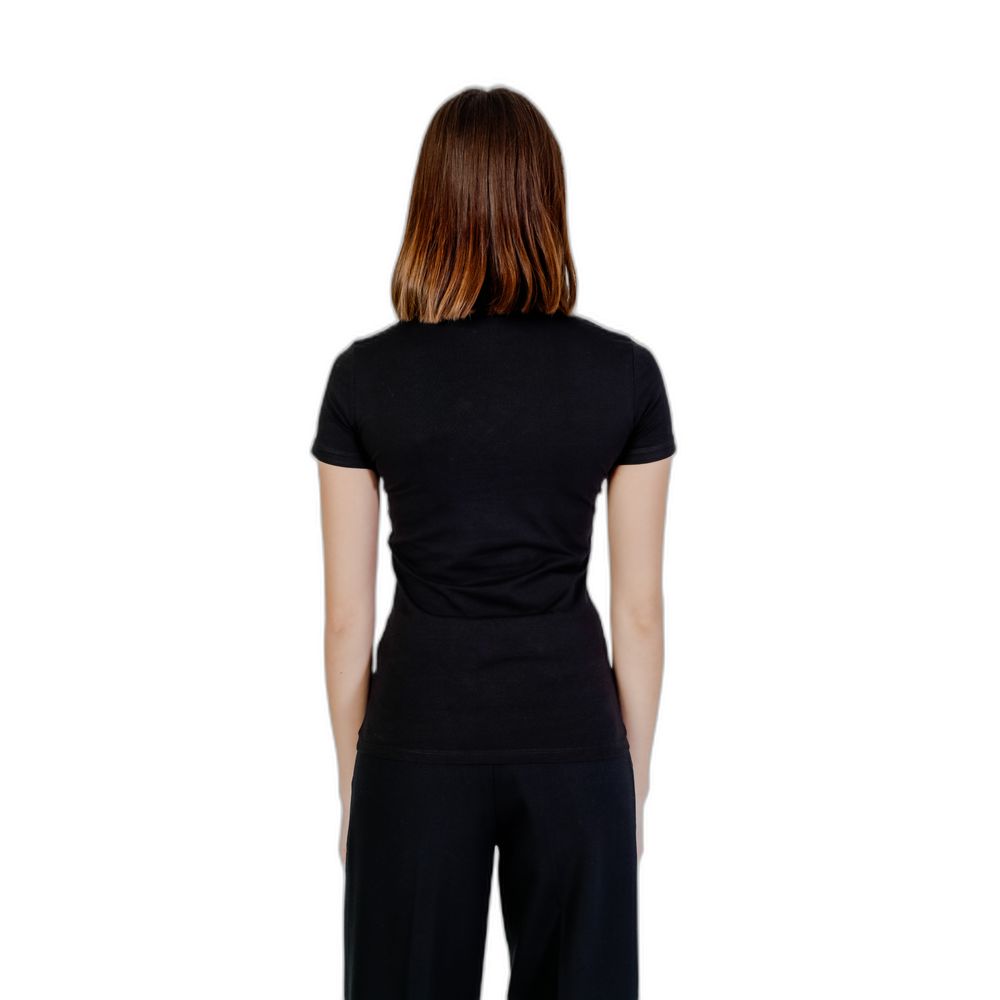 Back view of Guess Black Cotton T-Shirt worn by a model, showcasing the snug fit of the soft cotton blend; a wardrobe essential.