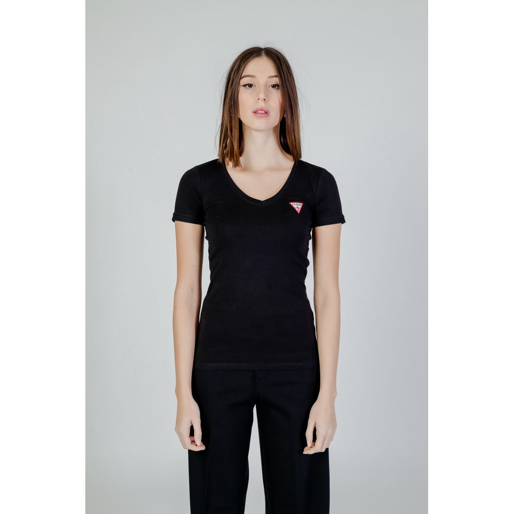 Woman wearing Guess Black Cotton T-Shirt with V-neckline and mini Guess Triangle logo, showcasing modern feminine design and comfortable fit.