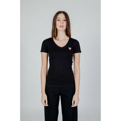 Woman wearing Guess Black Cotton T-Shirt with V-neckline and mini Guess Triangle logo, showcasing modern feminine design and comfortable fit.
