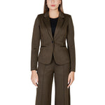 Woman wearing ICHI Green Polyester Blazer with jacquard fabric and classic cut, enhancing feminine silhouette and offering comfort.