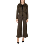 Woman wearing ICHI Green Polyester Blazer with matching trousers, showcasing a structured silhouette.