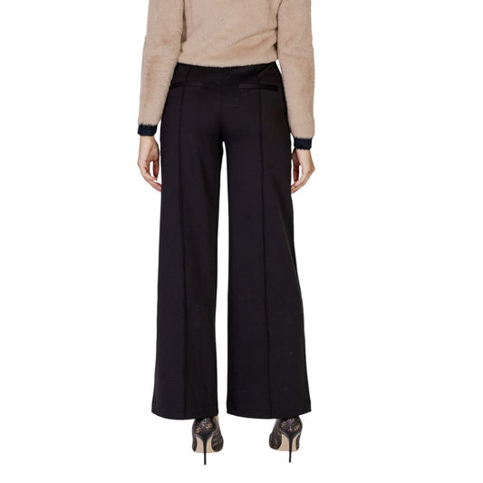 Back view of ICHI Black Polyester Pant for women, showcasing wide-leg design and high-quality fabric blend for elegance and comfort.