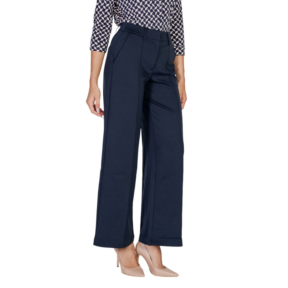 Woman wearing ICHI Blue Polyester Pant, wide-leg palazzo style, elegant and versatile for office wear.