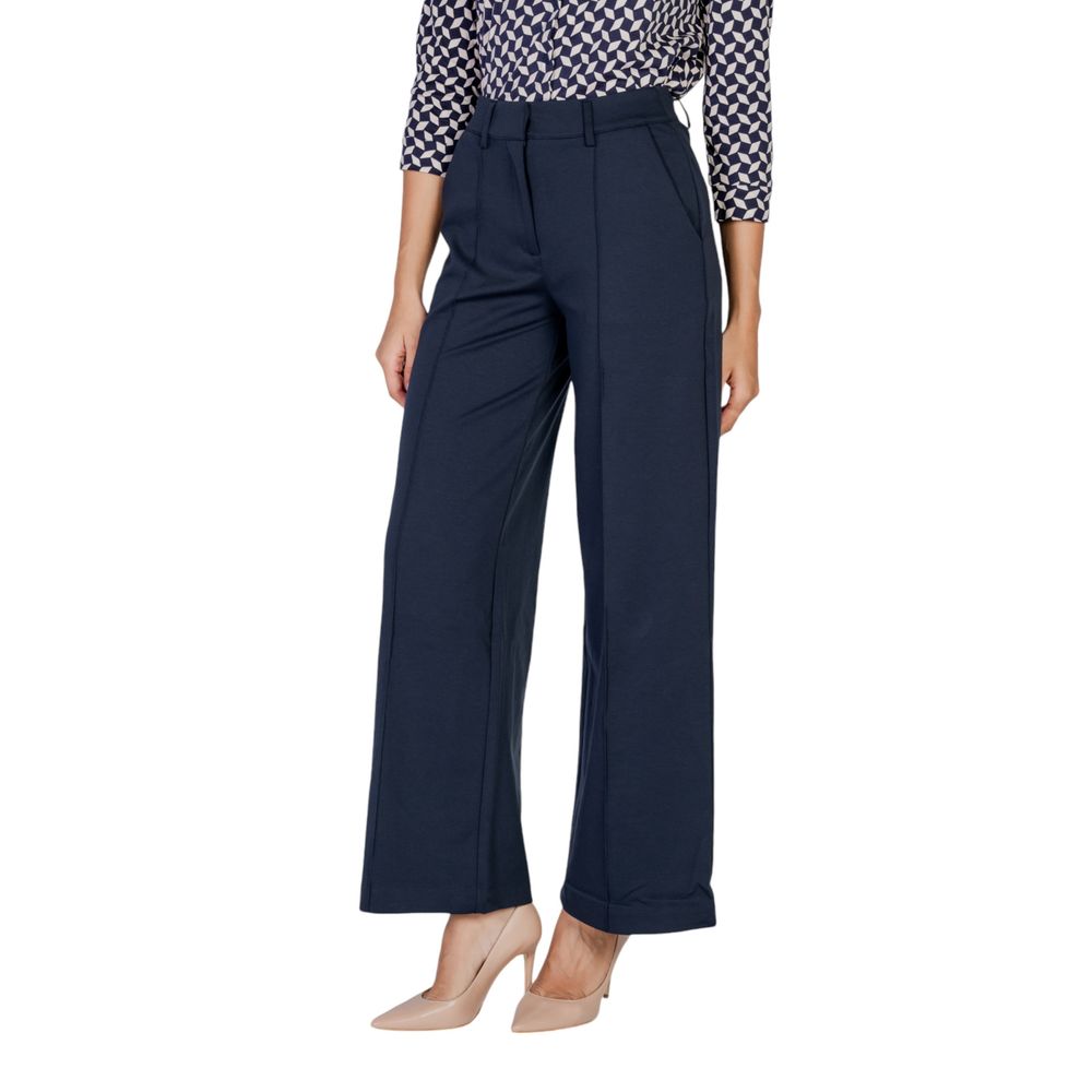 Woman wearing ICHI Blue Polyester Pant with wide-leg design and elegant fit, ideal for office wear and versatile styling.