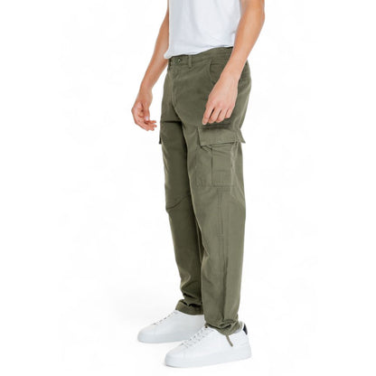 Model wearing Jack Jones Green Cotton Cargo Pants with tapered fit and side flap pockets, ideal for casual style and comfort.