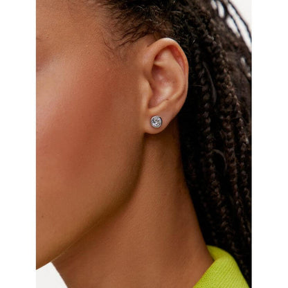 Lady wearing SWAROVSKI Mod. 5696073 earrings, Silver 925, quartz analog. Elegant design in an official box. 38mm case, resistant to 5 ATM.