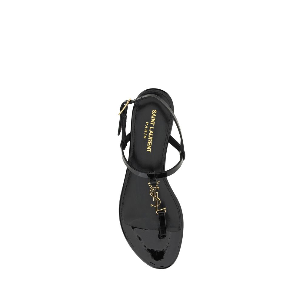 Alt Tag: Saint Laurent Black Calf Leather Bos Taurus Flat Sandals with ankle strap and embossed monogram top view.