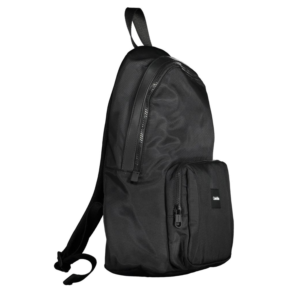 Calvin Klein Black Polyester Men Backpack with zip pockets and adjustable straps, ideal for style-conscious urban trendsetters.