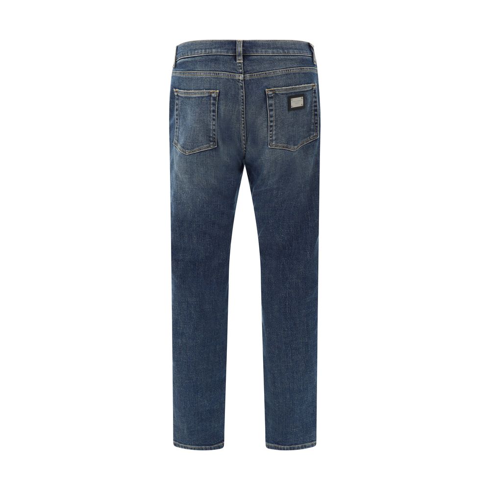 Dolce & Gabbana Jeans, back view showing five-pocket style, metal plaque with D&G monogram, straight fit, cotton with elastane, AW25.