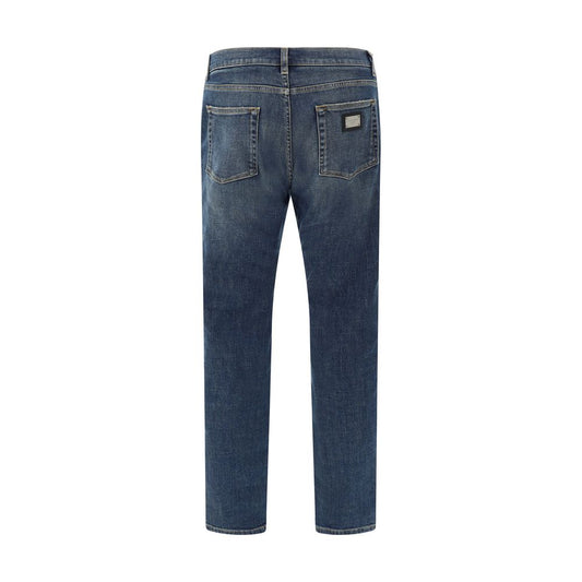 Dolce & Gabbana Jeans, back view showing five-pocket style, metal plaque with D&G monogram, straight fit, cotton with elastane, AW25.