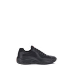 Prada America's Sneakers in black, featuring lace-up closure and textured sole for style and comfort.
