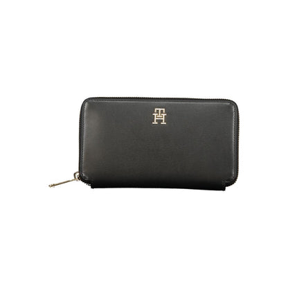 Tommy Hilfiger Black Polyethylene Wallet with zip closure, 4 compartments, coin purse, card spaces, and logo.