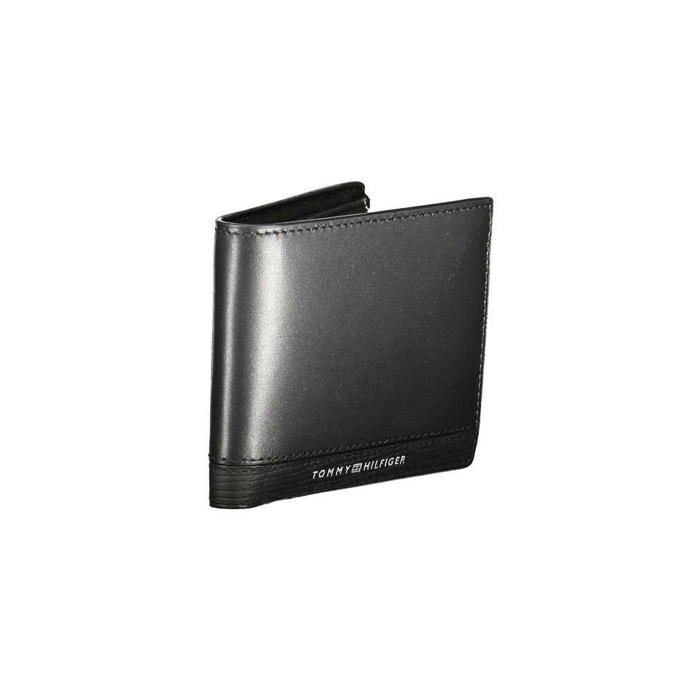 Tommy Hilfiger Black Leather Men Wallet with compartments and card slots, featuring iconic logo for stylish everyday use.