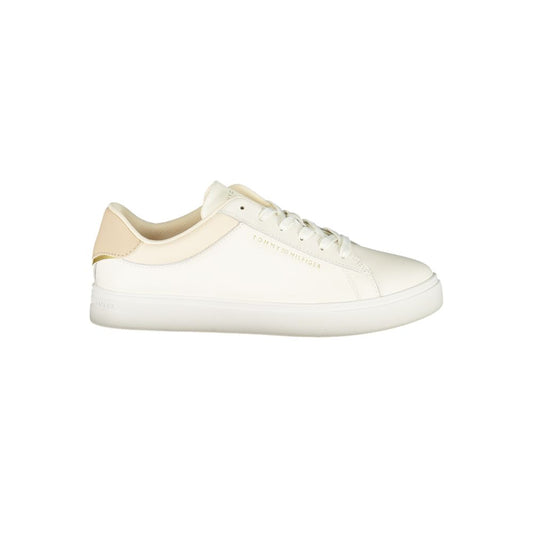 Tommy Hilfiger Beige Leather Women Sneaker with iconic logo on sleek beige trainers showcasing style and comfort.