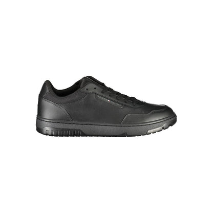 Tommy Hilfiger Black Leather Men Sneaker with iconic logo and removable footbed for tailored comfort, showcasing urban chic design.