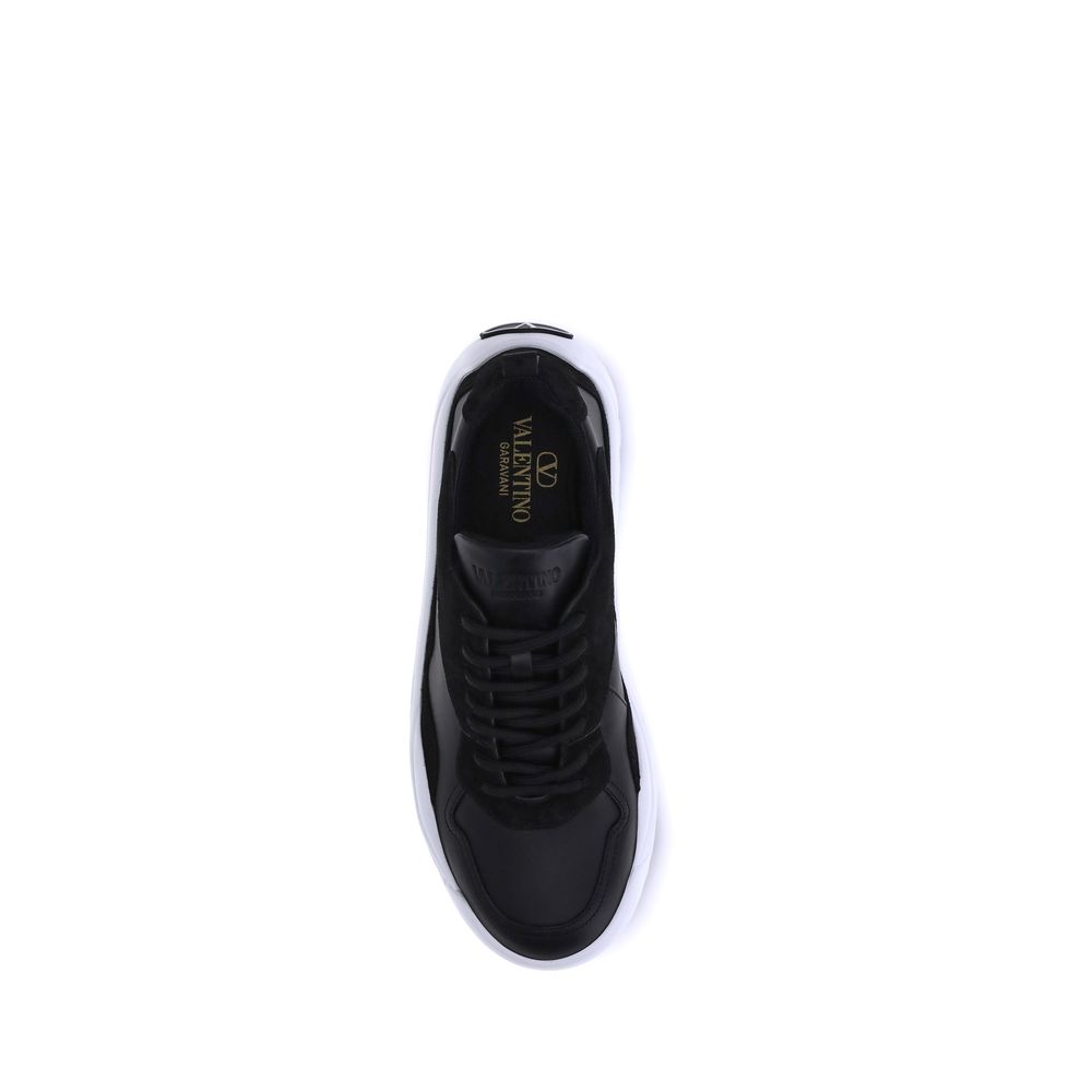 Top view of Valentino Garavani Black Calf Leather Bos Taurus Chunky Sneakers with logo on tongue and preformed sole.