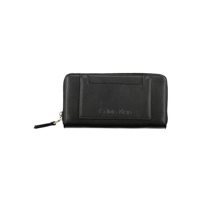 Calvin Klein Black Polyester Wallet with zipper closure, multiple compartments, coin purse, and logo, made from 50% recycled materials.