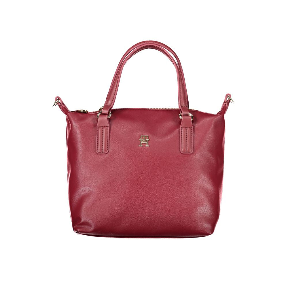 Tommy Hilfiger Red Polyester Handbag with two handles, adjustable and removable shoulder strap, internal pocket, zip closure and logo.