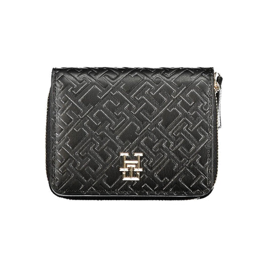Tommy Hilfiger Black Polyethylene Wallet featuring coin purse, double card spaces, contrasting details, zip and automatic closure.