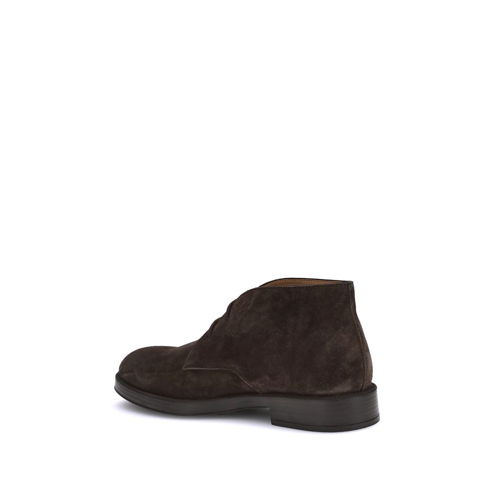 Rear view of Tod's Brown Calf Leather Bos Taurus Ankle Boots showcasing suede and rubber heel detail, ideal for stylish elegance.