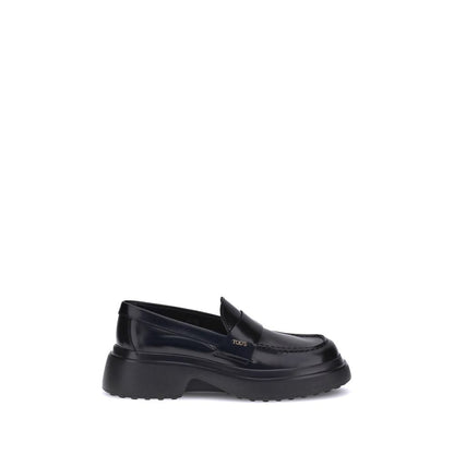 Tod's Black Rubber Platform Loafers with patent leather and rounded toe side view.