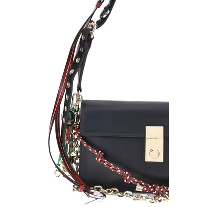Prada Black Calf Leather Bos Taurus Shoulder Bag with gold accents and decorative chain.