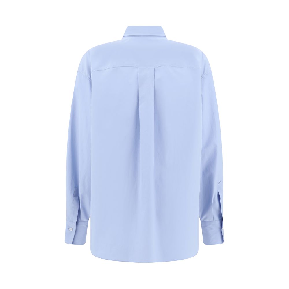 Brunello Cucinelli Light Blue Cotton Dress Shirt back view showcasing classic design and adjustable cuffs.