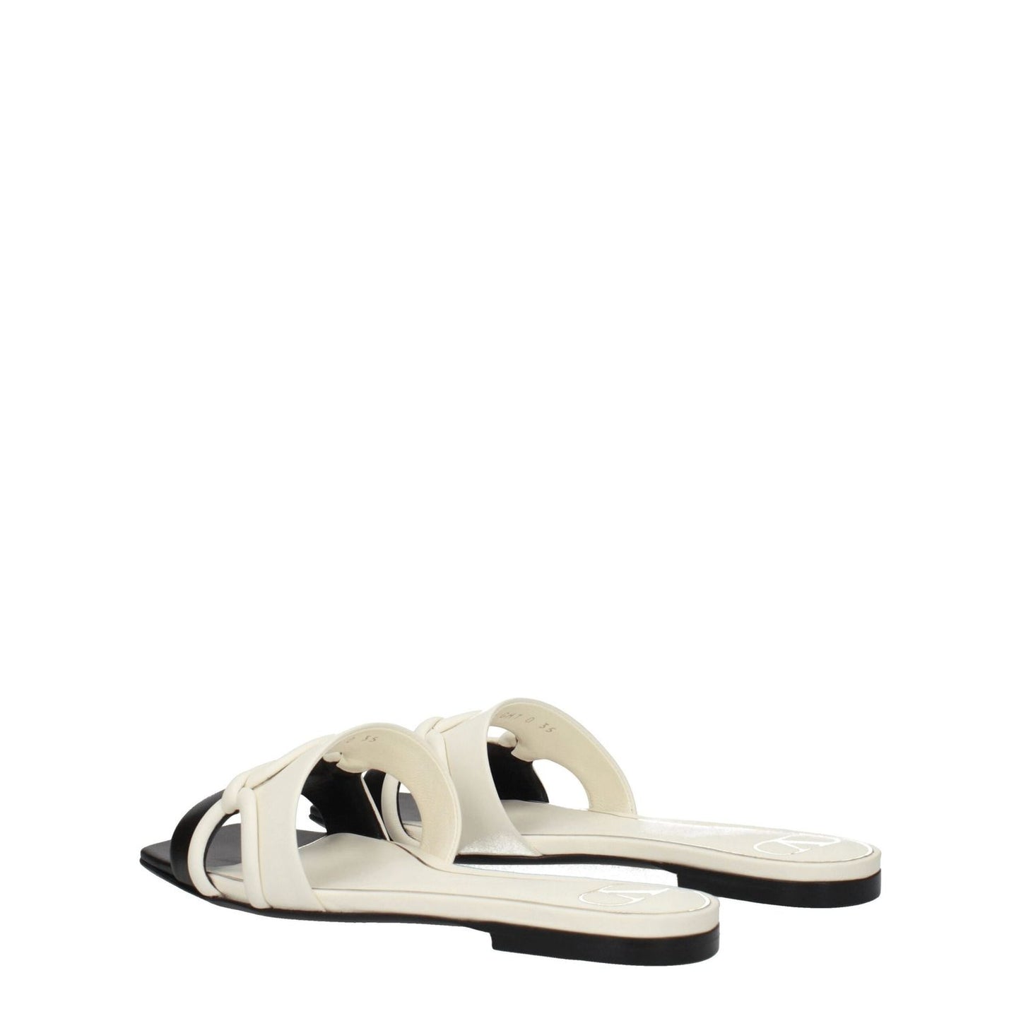 Valentino Garavani Black Leather Slippers with open toe and ivory accents, featuring low flat heel and leather sole. Casual style footwear.