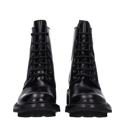 Church's Black Leather Ankle Boots with lace-up closure and low flat heel, featuring a vintage effect and rubber sole.