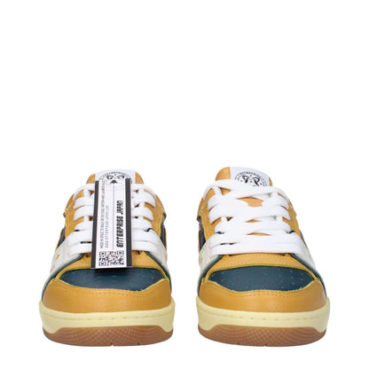 Enterprise Japan Green Leather Low Top Sneakers with mustard accents and front logo detail, featuring lace-up closure and rubber sole.