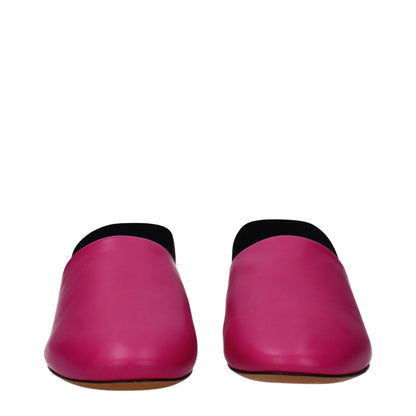 Givenchy Pink Leather Flat Sandals with round toe and low heel, featuring side and back logos, in fuchsia leather.