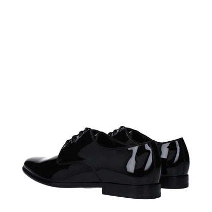 Dolce & Gabbana Black Leather Oxfords And Derbies with patent finish, lace-up, pointy toe on leather sole.