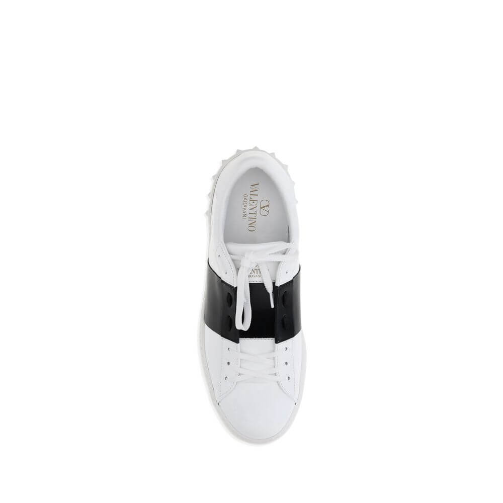 Valentino Garavani White Calf Leather Bos Taurus Low Top Sneakers with black side band and heel studs.
