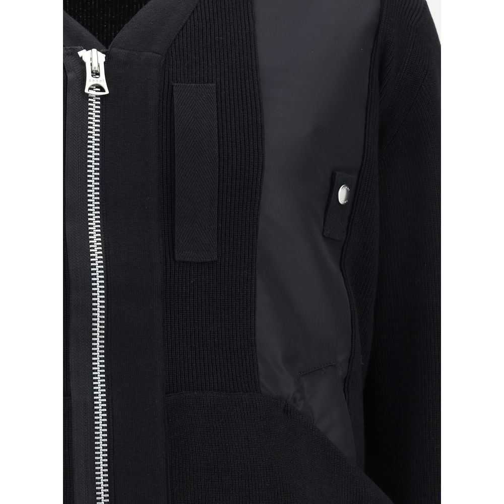 Front view with bag zipped and handles upright.