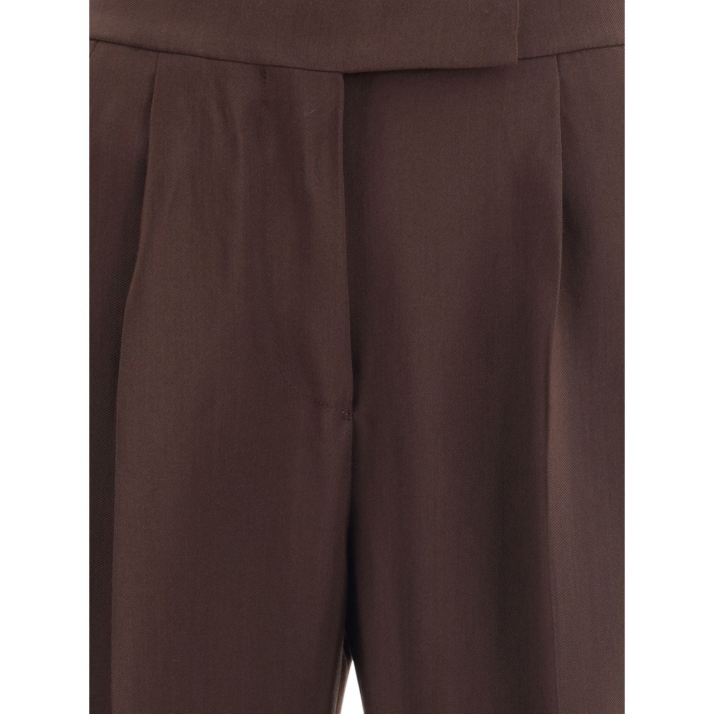 Close-up of Tom Ford Brown Viscose Casual Pants showcasing elegant wide leg design and detailed side buckles, made in Italy.